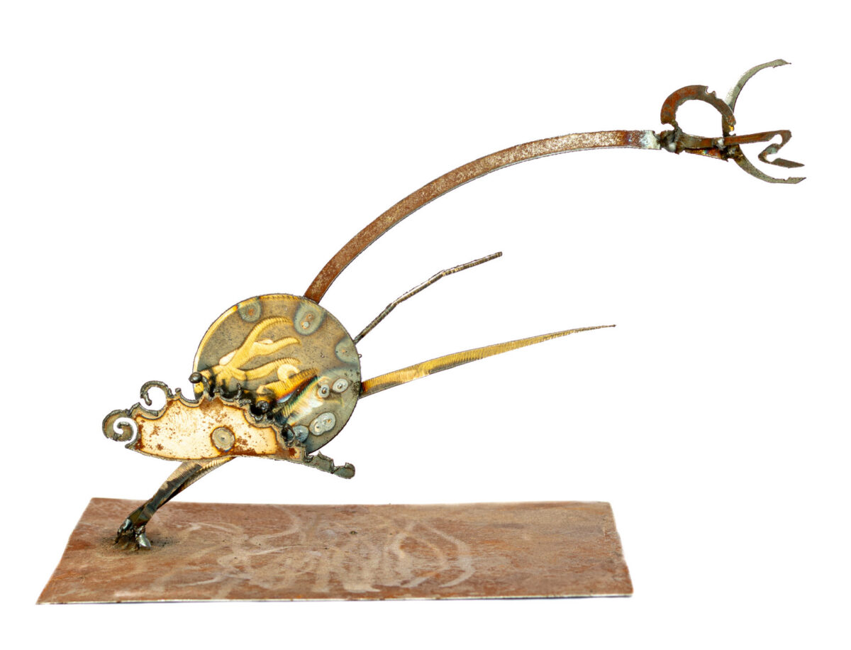 Freestanding hand-welded steel sculpture by Afatasi featuring an abstract winged form with a rounded body, radiating points, and a long upward-curving extension.