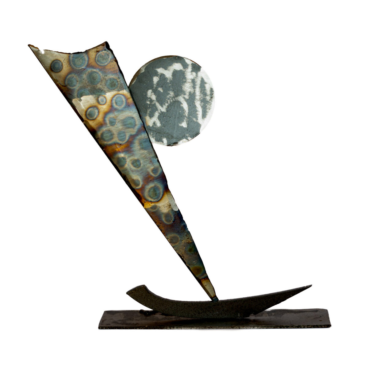 Freestanding welded-steel sculpture by Afatasi showing a single sailboat beneath a round moon on a rectangular metal base.