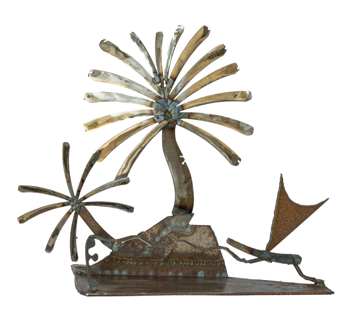 Freestanding hand-welded steel sculpture by Afatasi depicting two palm trees, layered island forms, and a small sailboat on a rectangular metal base.