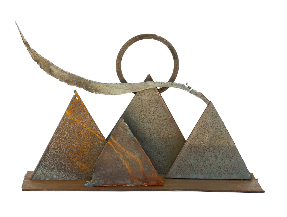 Freestanding hand-welded steel sculpture by Afatasi featuring four angular mountain forms, a circular sun, and a long sweeping horizon line on a rectangular base.