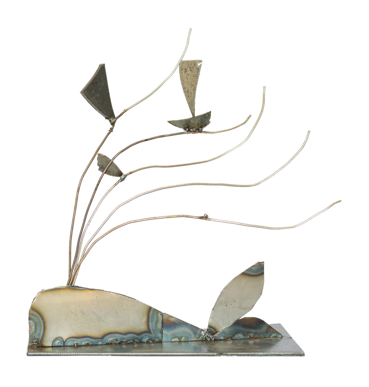 Freestanding hand-welded steel sculpture by Afatasi featuring slender wave-like stems rising from a low shoreline form, with several tiny sailboat shapes suspended along the curving lines.