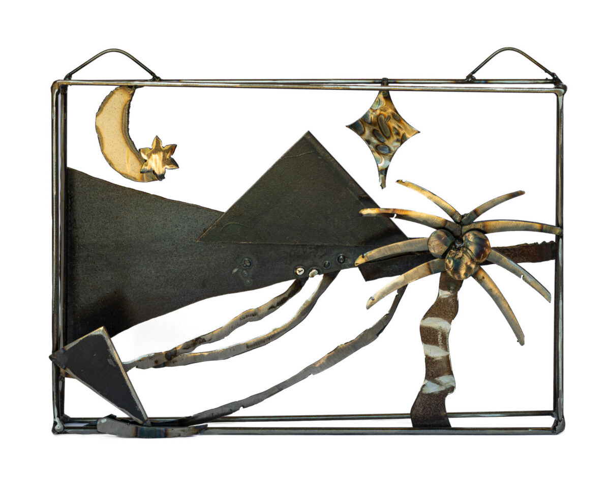 Salvaged-steel wall sculpture by Afatasi depicting a pyramid, palm tree, crescent moon, star, and flowing landscape within a rectangular frame.