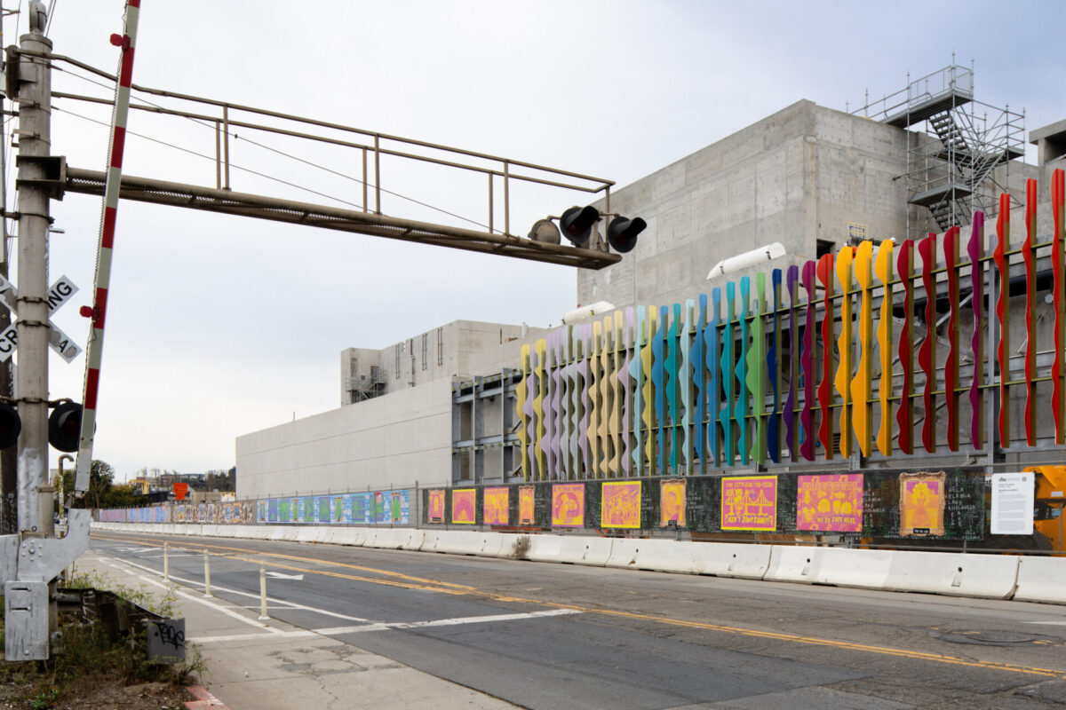 Afatasi The Artist; Modalitites and Motifs; 2023; Southeast Wastewater Treatment Plant Construction Fence Temporary Mural Installation; Photo Credit Ethan Kaplan; Courtesy of the San Francisco Arts Commission